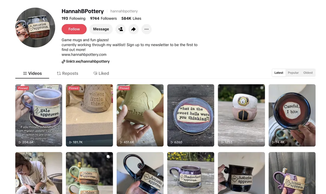 The HannahBPottery TikTok profile: 9,744 followers, 584K likes, and a grid of stamped game mugs held up to the camera.